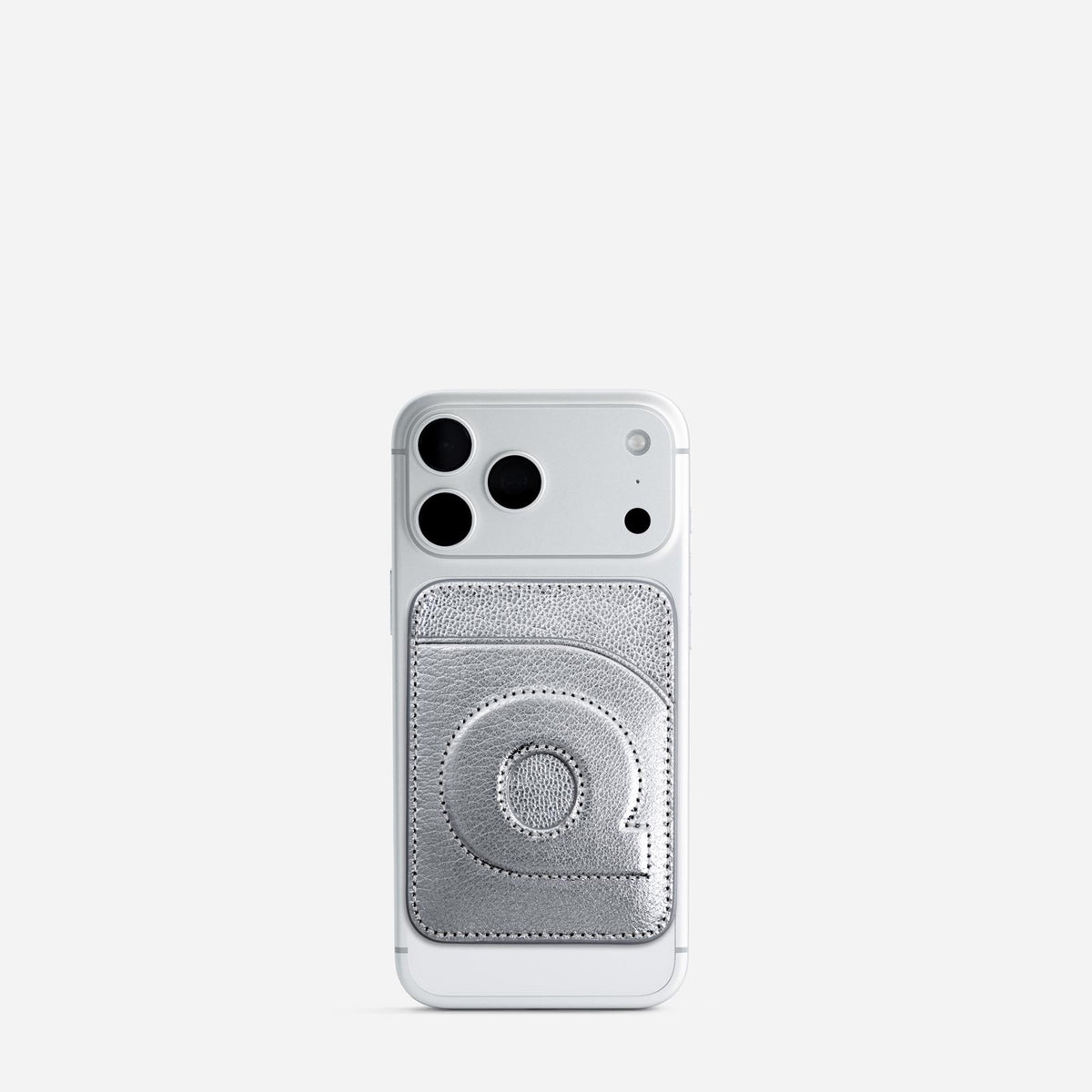 MagSafe cardholder in Metallic Silver, initial Q, on phone