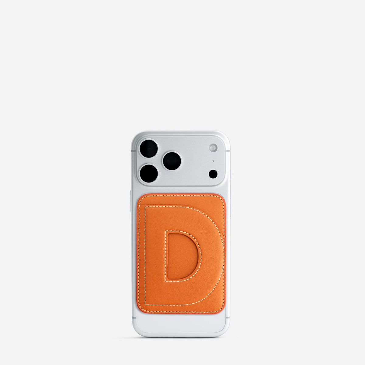 MagSafe cardholder in Orange, initial D, on phone