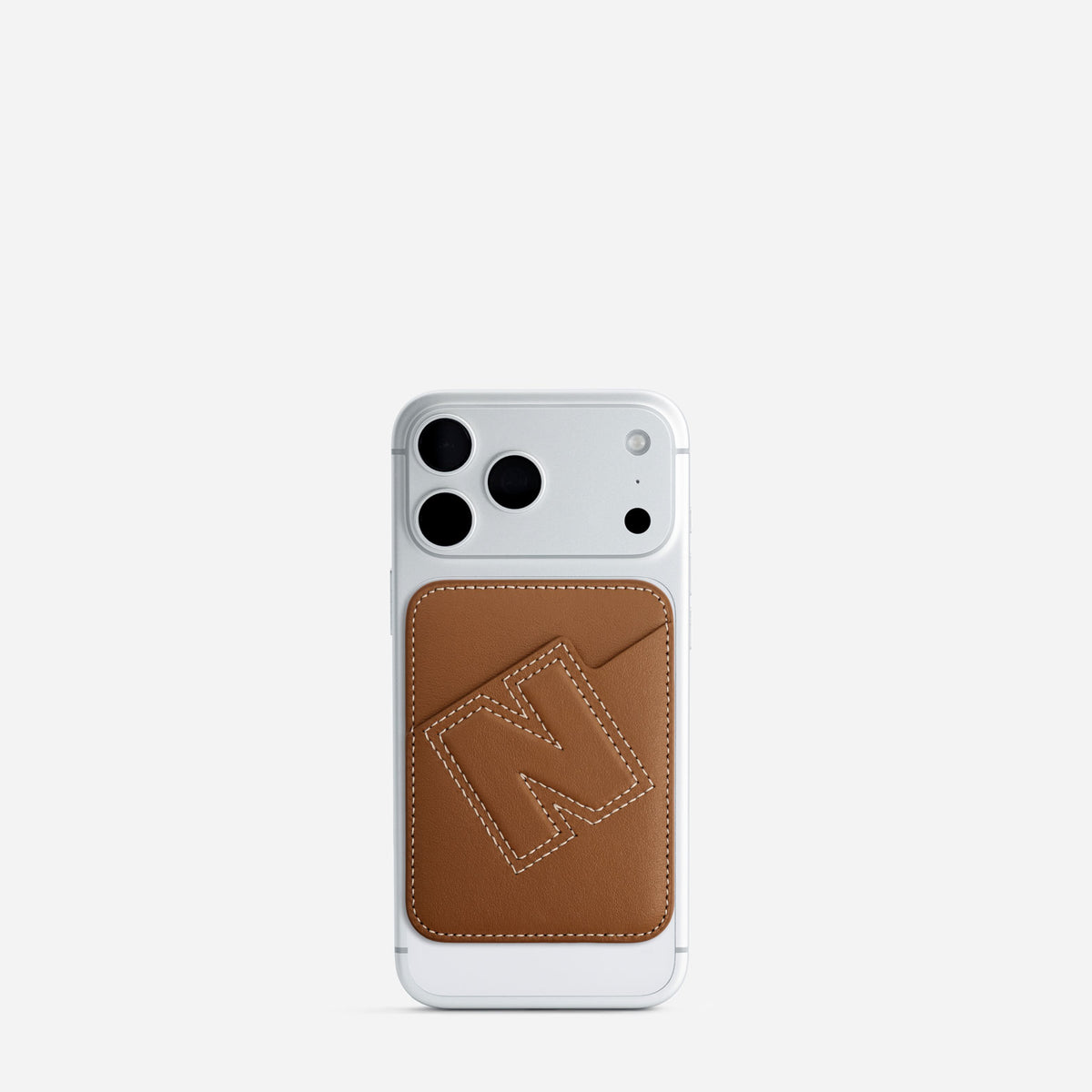 MagSafe cardholder in Canyon, initial N, on phone