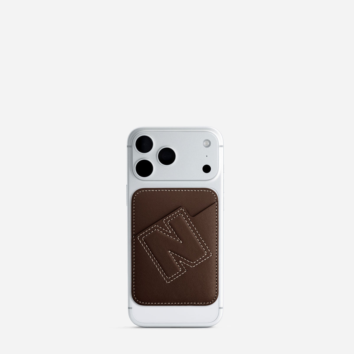 MagSafe cardholder in Espresso, initial N, on phone