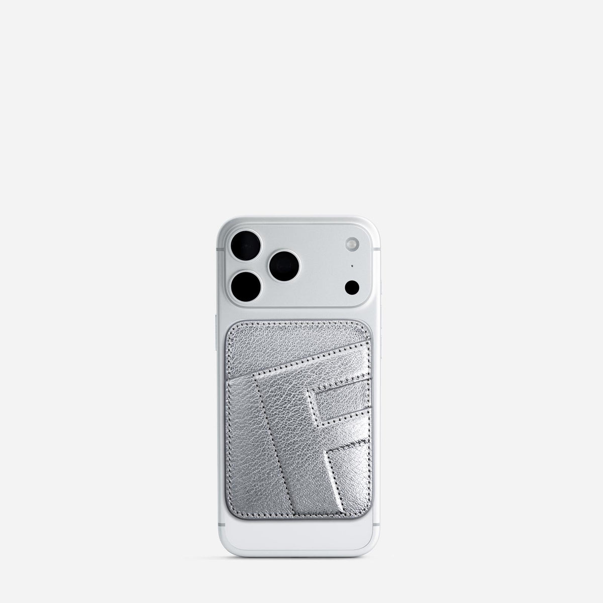 MagSafe cardholder in Metallic Silver, initial F, on phone