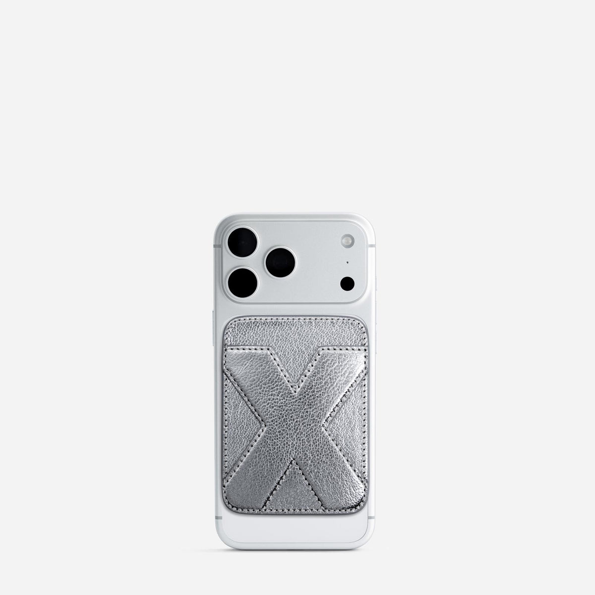 MagSafe cardholder in Metallic Silver, initial X, on phone