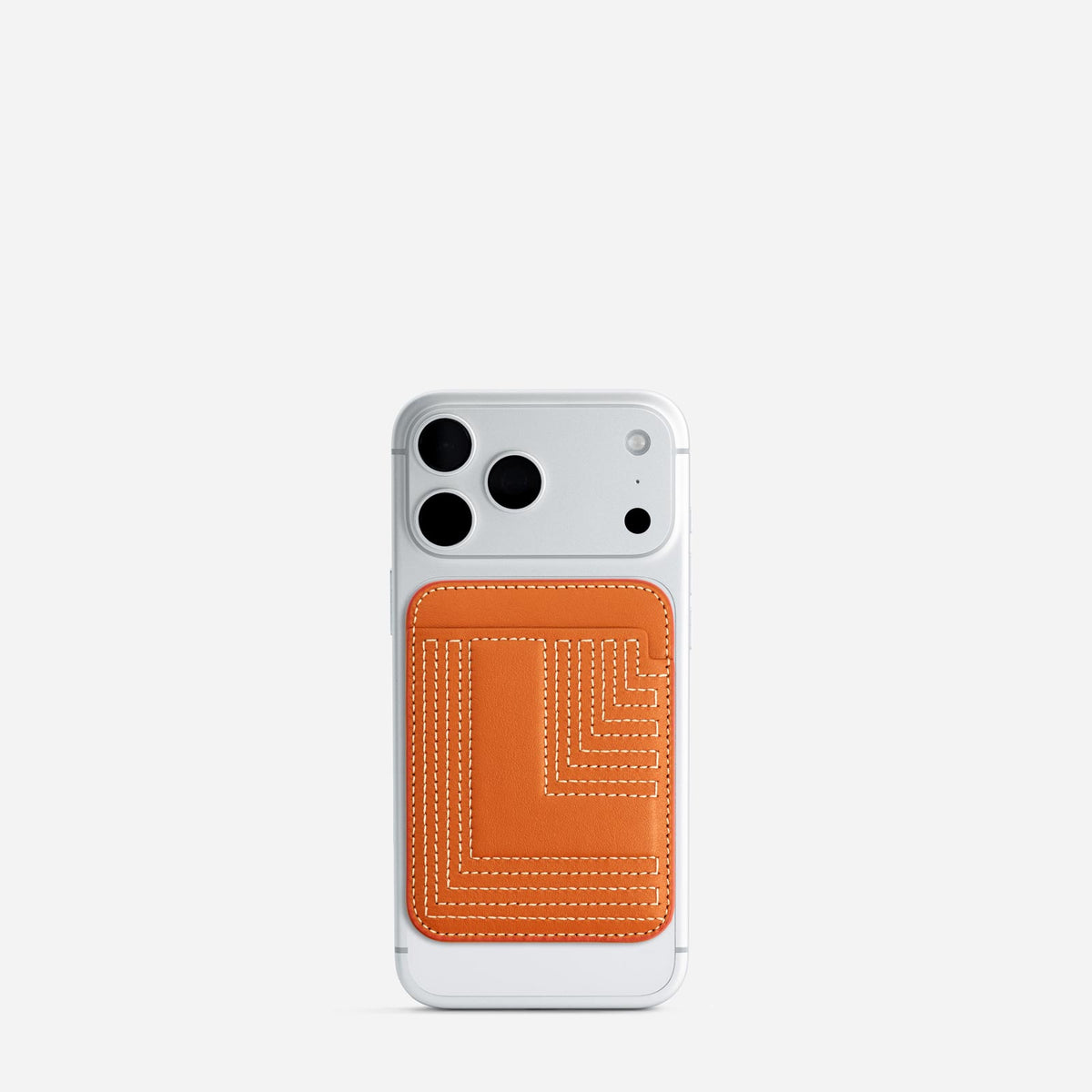 MagSafe cardholder in Orange, initial L, on phone