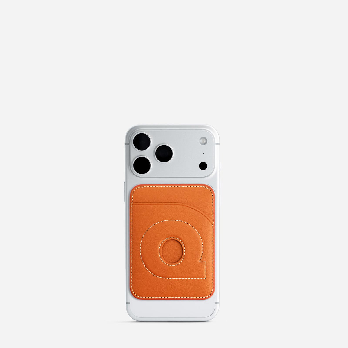 MagSafe cardholder in Orange, initial Q, on phone